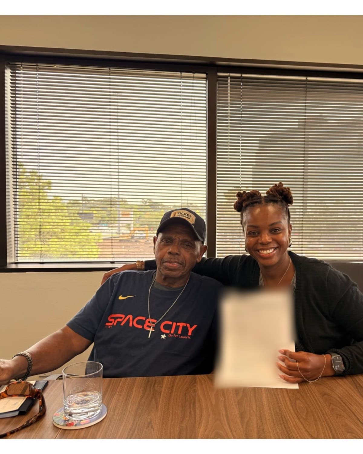 Josie Smith and her father at the attorney’s office on the day the property was transferred to the charity.