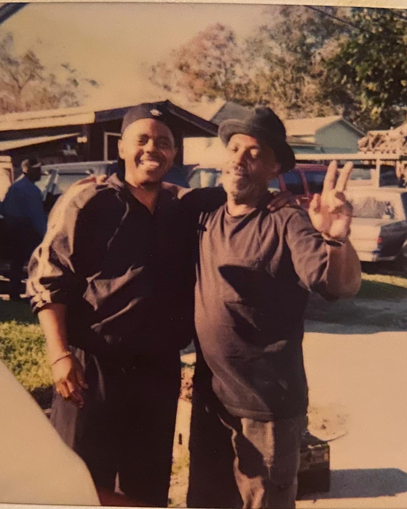 Two men standing in front of the family home in Sunnyside, from the family archive.
