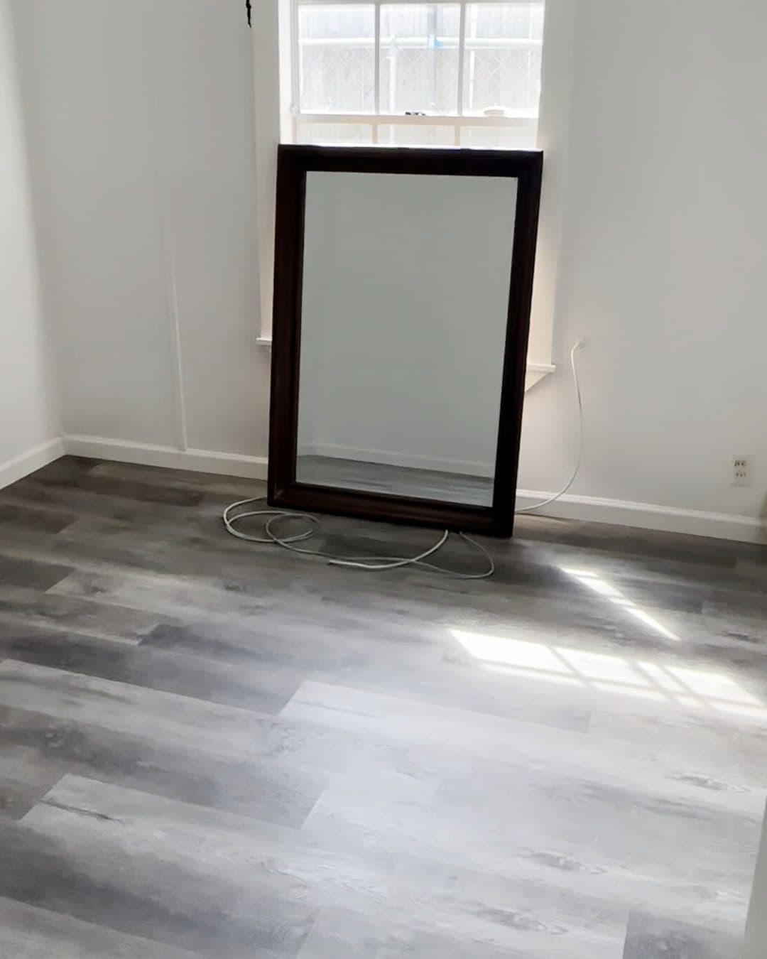 Interior room with window, present condition.